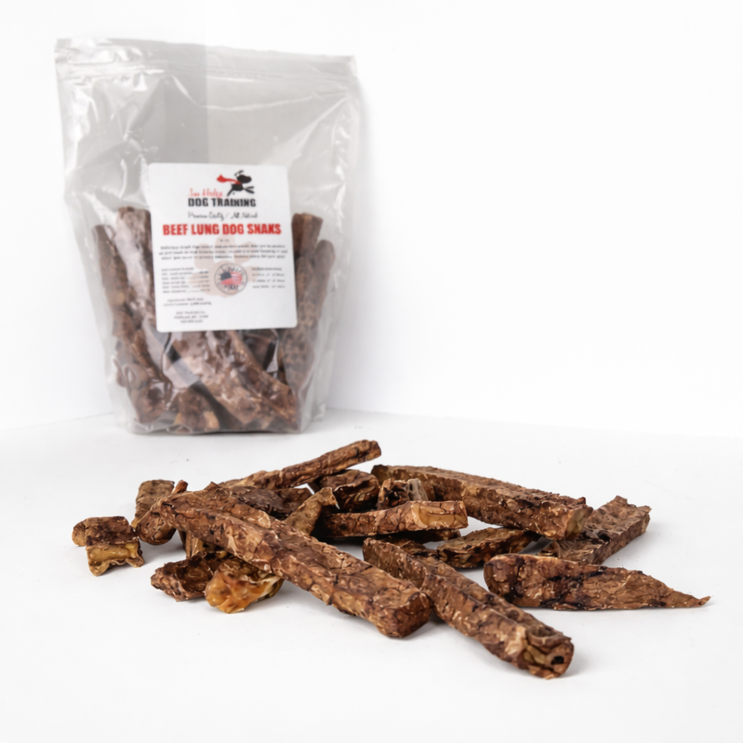 Loose beef lung dog treats in foreground with resealable bag in background, single ingredient dehydrated beef lung training treats made in the USA