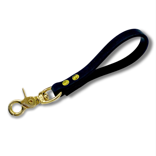 Black Biothane dog training pull tab with premium brass snap hardware for obedience training, recall training, and off-leash dog control. Durable waterproof K9 training tab leash designed for behavior correction, professional dog training, and everyday handling with strong rivets and comfortable grip.