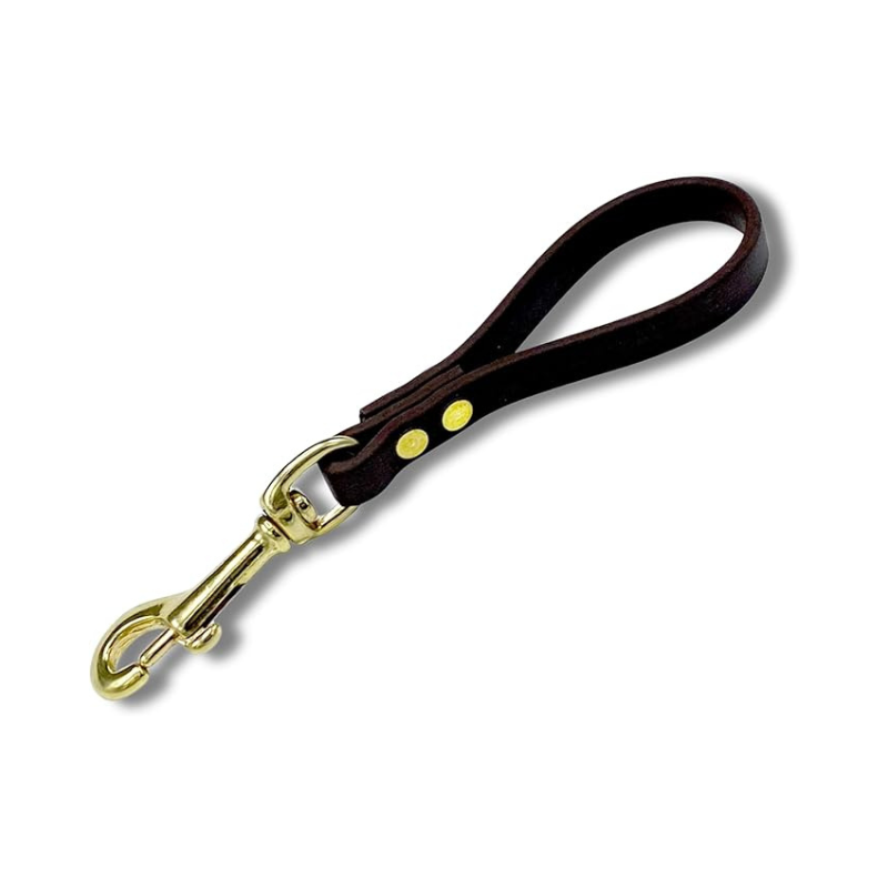 Brown Biothane pull tab for dog training with brass snap hook and durable waterproof construction.