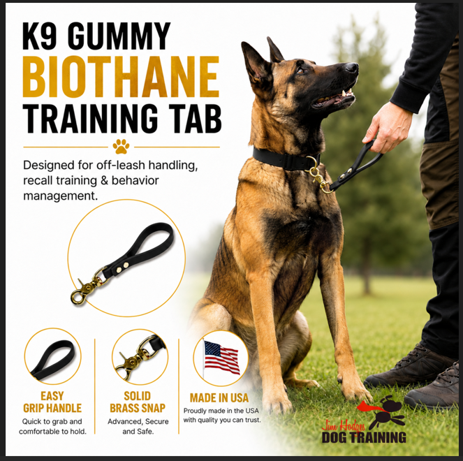 Jim Hodges K9 Gummy Biothane training tab for dogs featuring durable waterproof Biothane material and solid brass snap hardware. Made in USA dog training tab designed for off-leash handling, recall training, obedience training, and behavior management. Heavy-duty black K9 training tab shown with German Shepherd dog for professional dog training and everyday control.