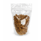 Whole chicken dog treats made in the USA, single-ingredient dehydrated white and dark chicken meat pieces in a clear resealable 8 oz bag
